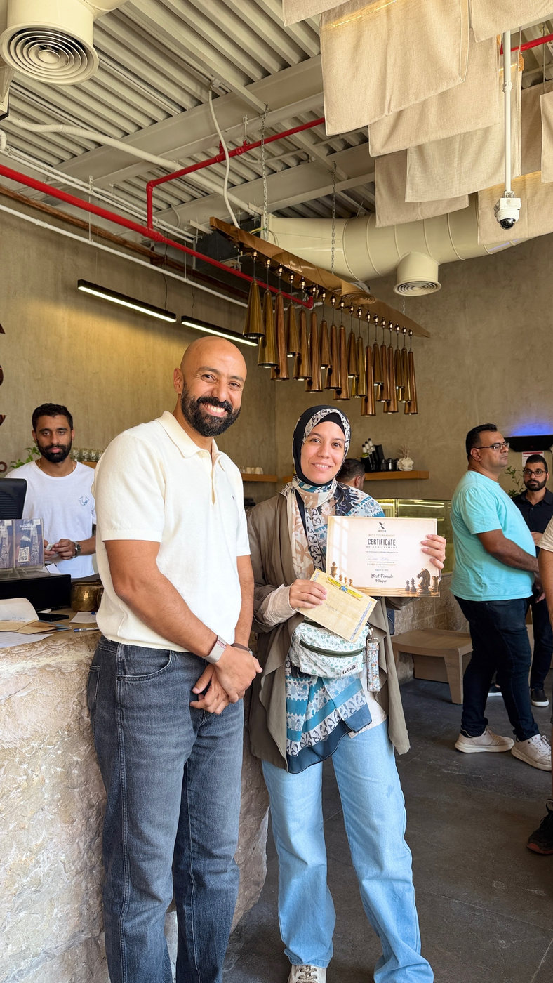 A player receiving her certificate
