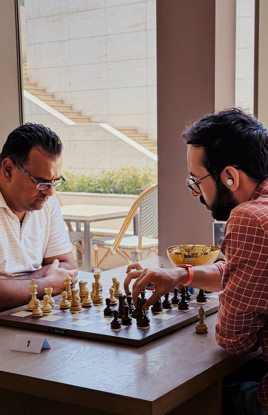 Two players mid-game at the rapid tournament